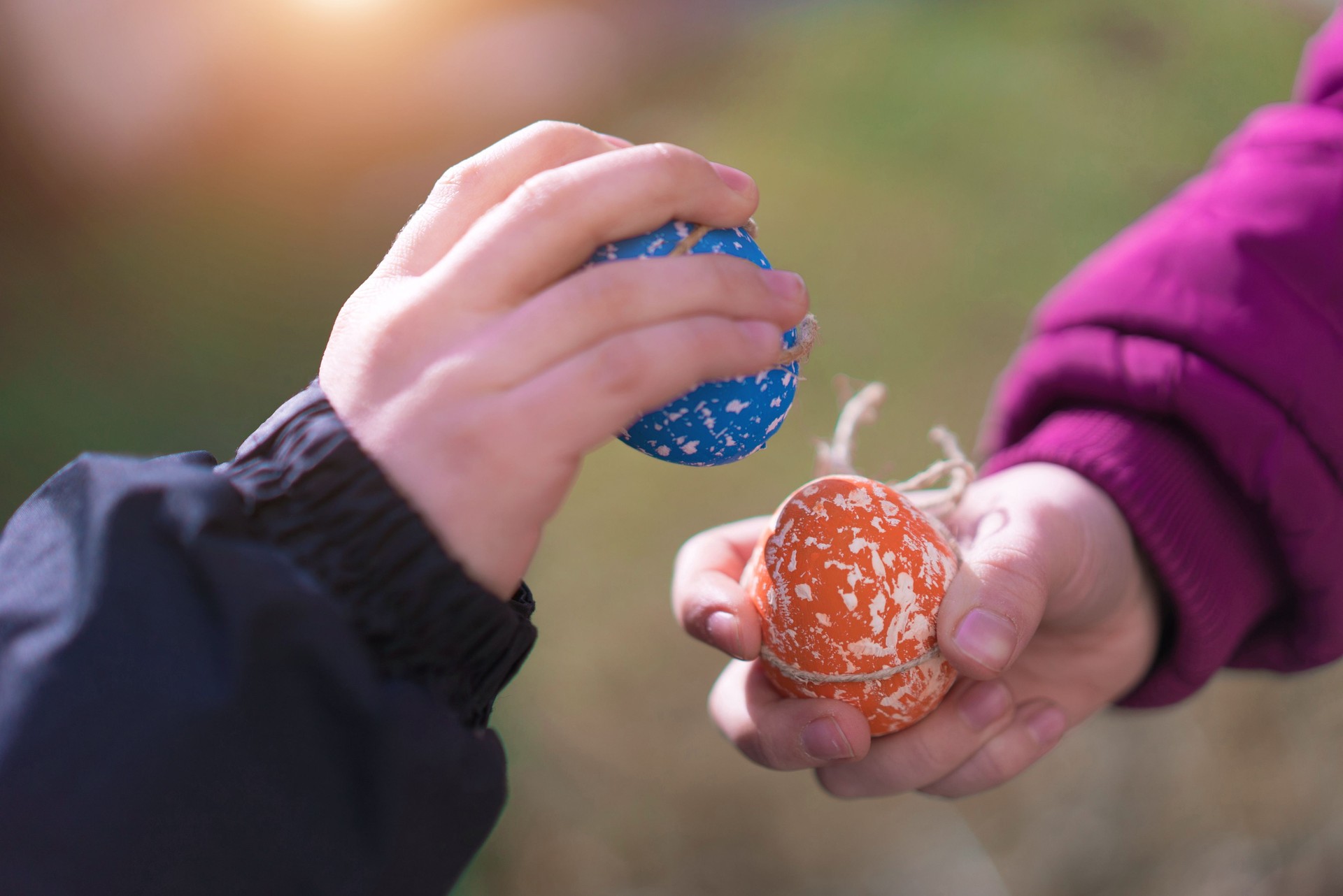 Two Kids Breaking Easter Eggs